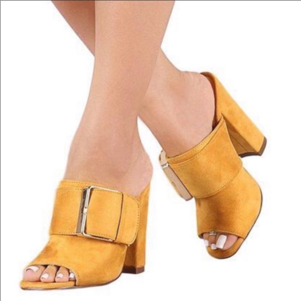 Mustard buckle heel, new in box.